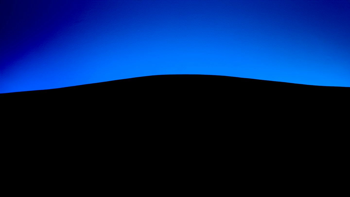 Black line separates blue gradient and black background.