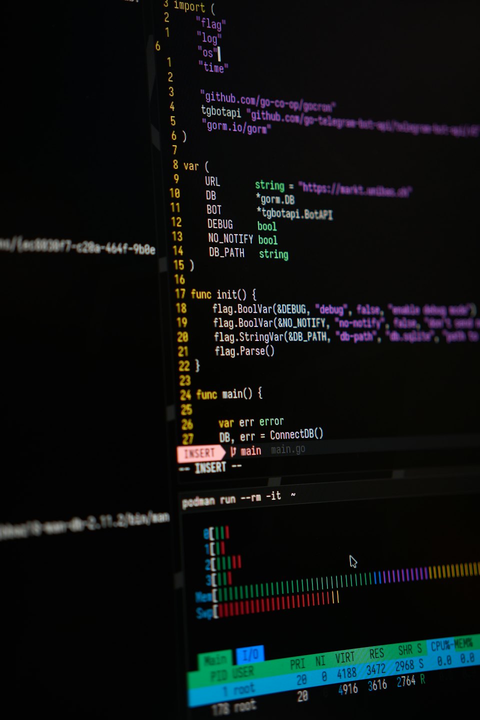 Computer screen showing programming code and system metrics.